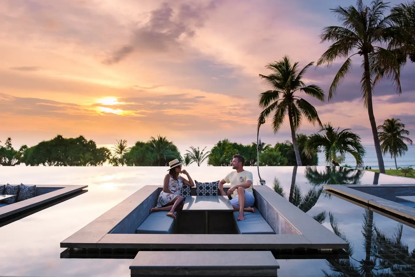 Sunken lounge inside an infinity pool at sunset